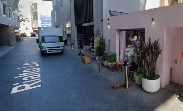A white truck parked on a street

Description automatically generated