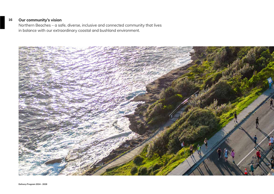 A group of people walking on a path next to a body of water

Description automatically generated