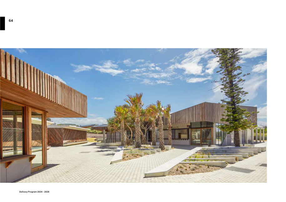 A building with trees and a walkway

Description automatically generated